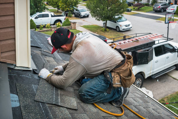 Professional Gutter Repair And Installation technician working in Manorville, NY